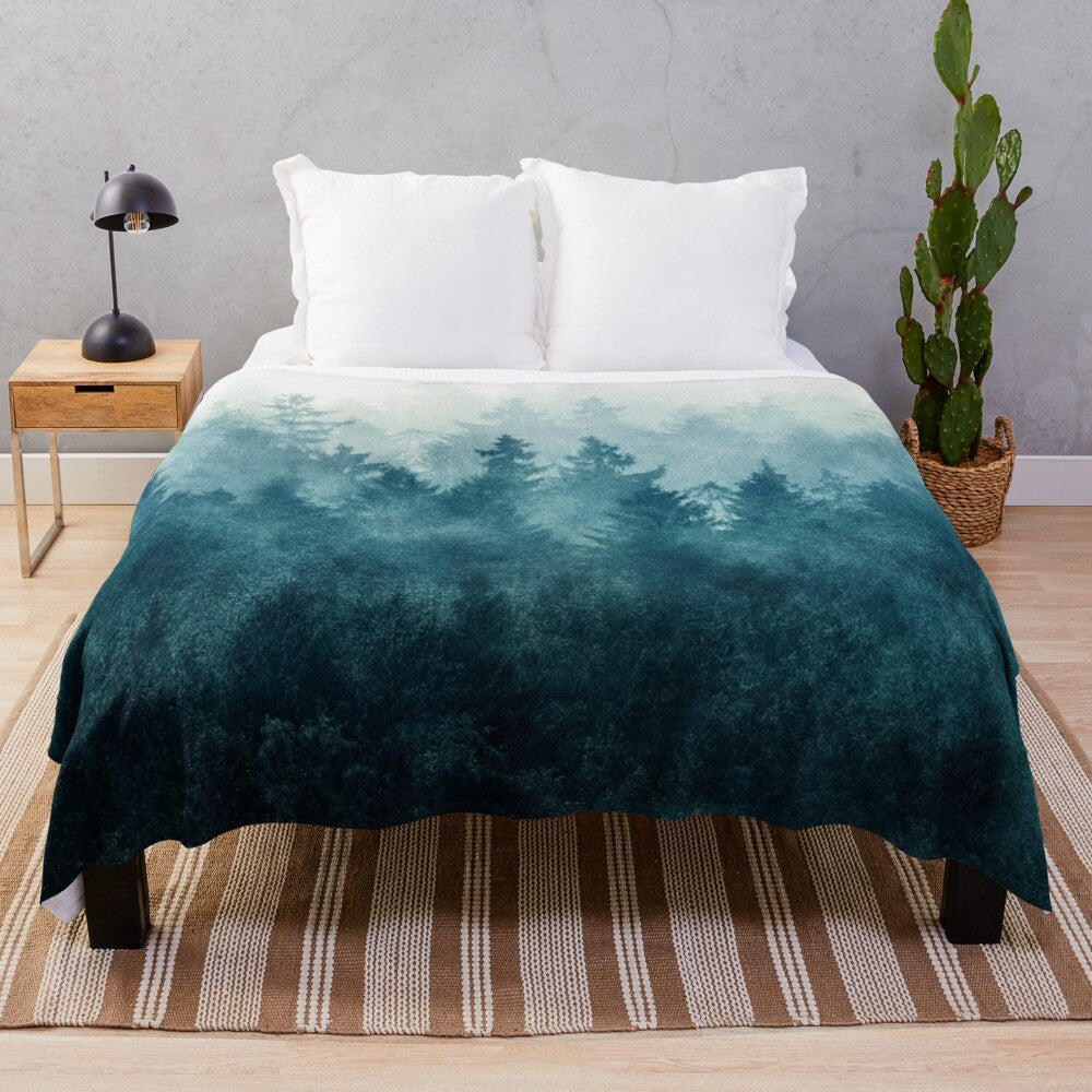 Plush blanket featuring a dreamy, foggy forest landscape