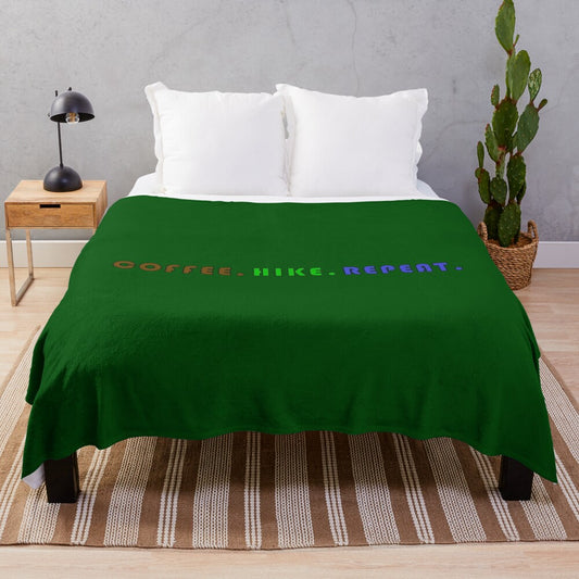 Cozy plush blanket with "Coffee. Hike. Repeat." design