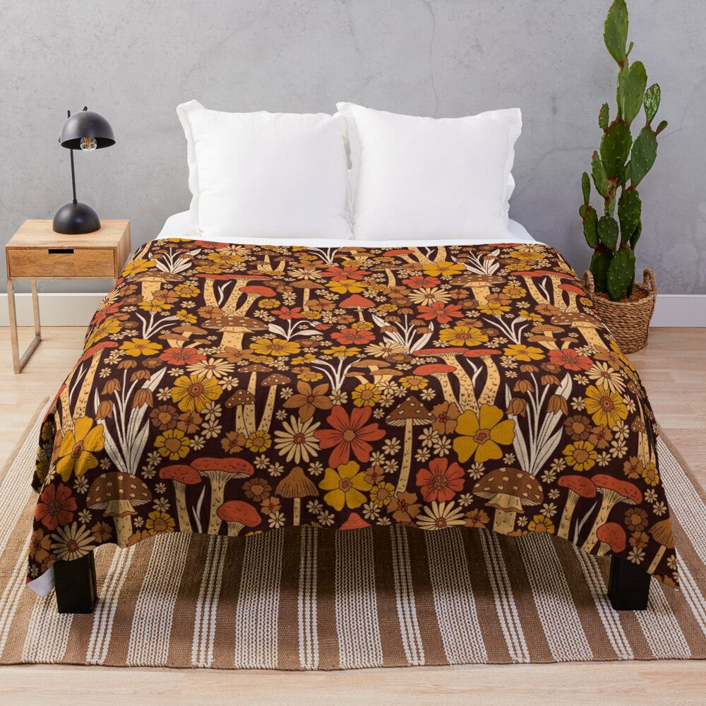 Retro 1970s inspired plush blanket with brown, orange, and yellow mushrooms and flowers