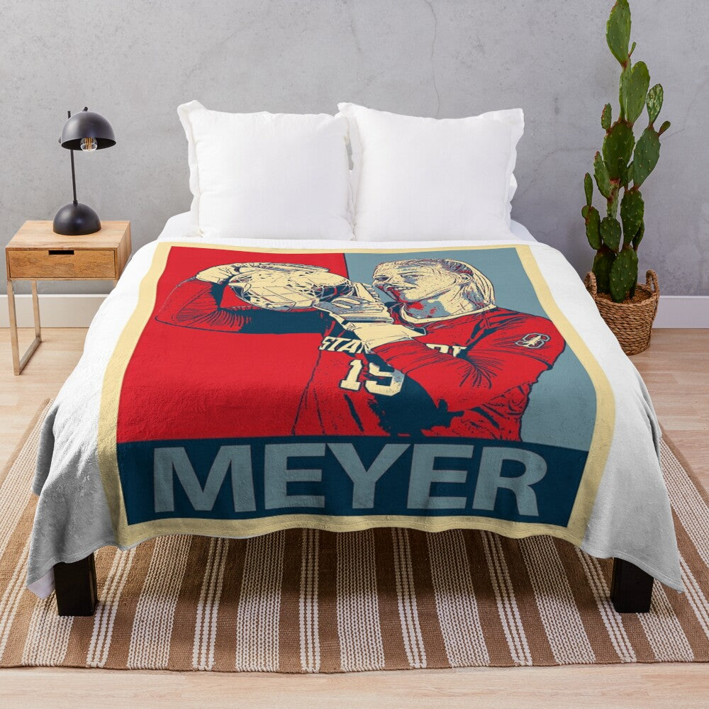 Women's plush blanket featuring a tribute design for Katie Meyer, a former collegiate goalkeeper