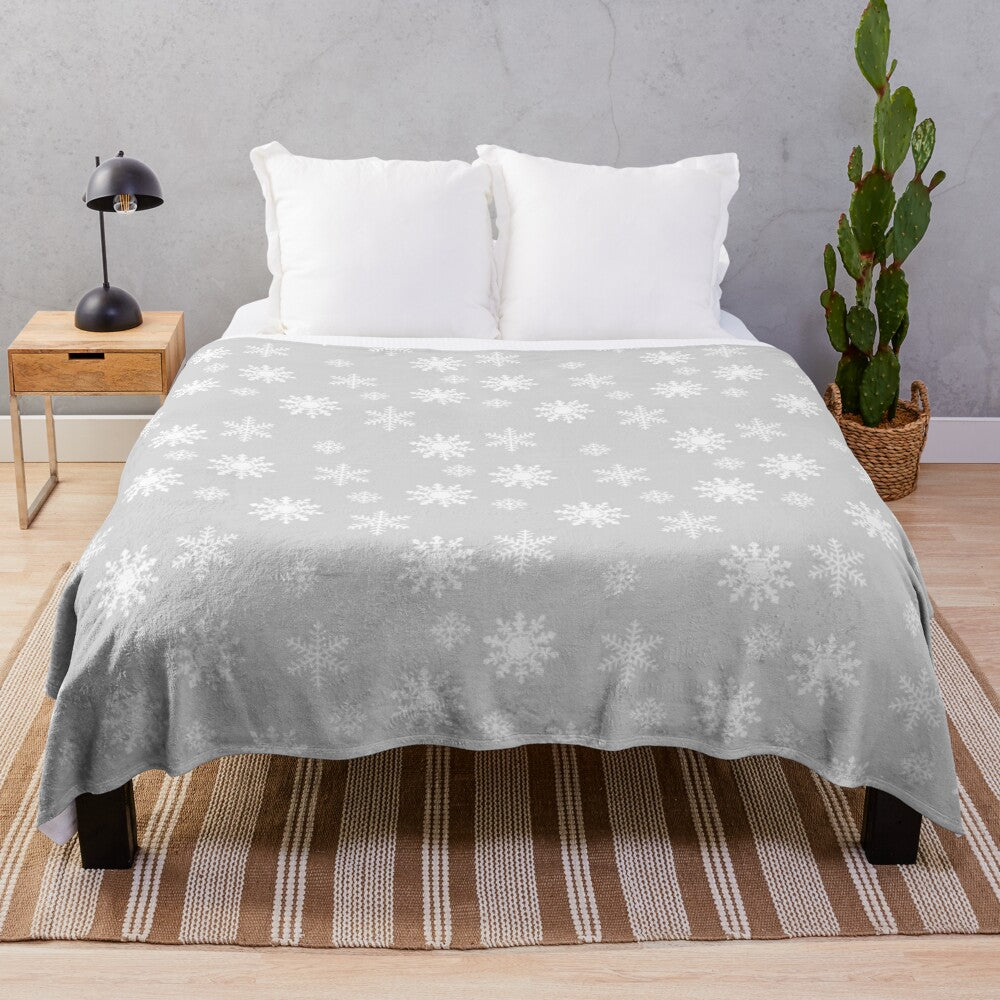 Soft and cozy plush blanket with delicate snowflake design