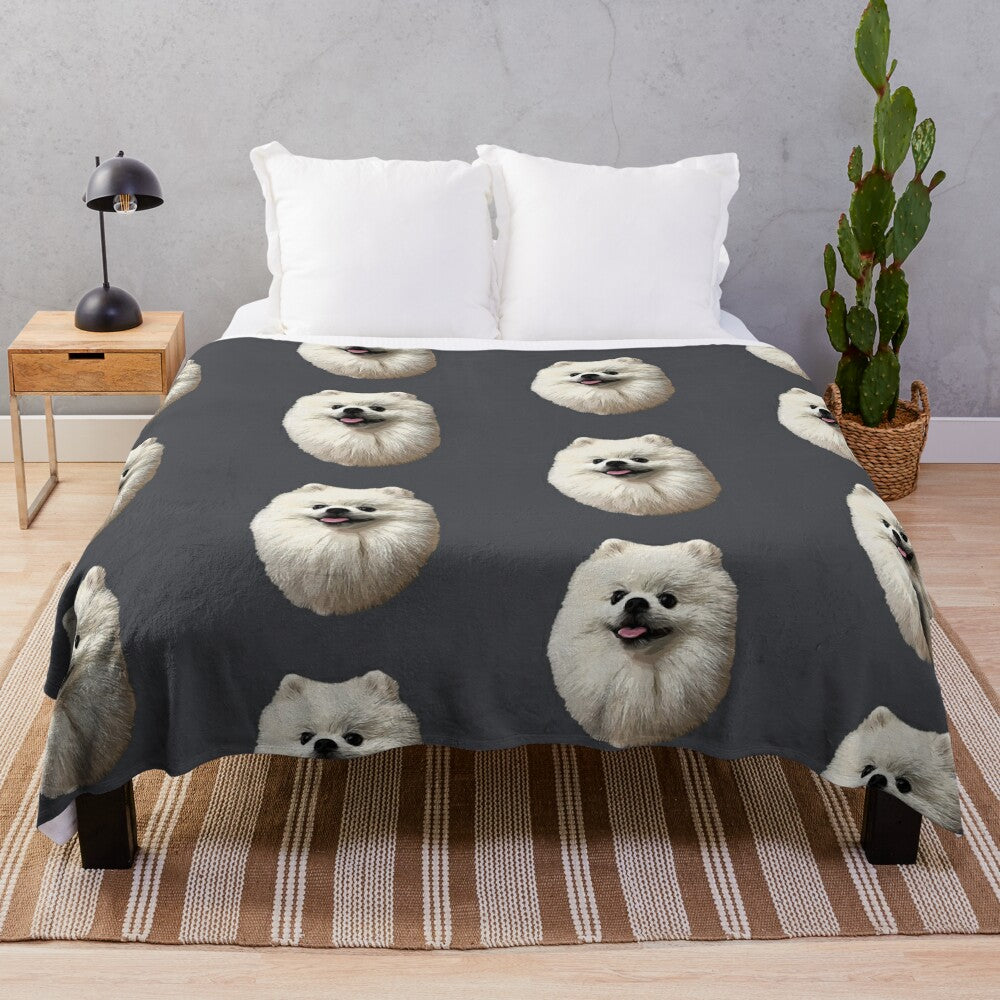 Soft and cozy plush blanket featuring a cute white pomeranian puppy design