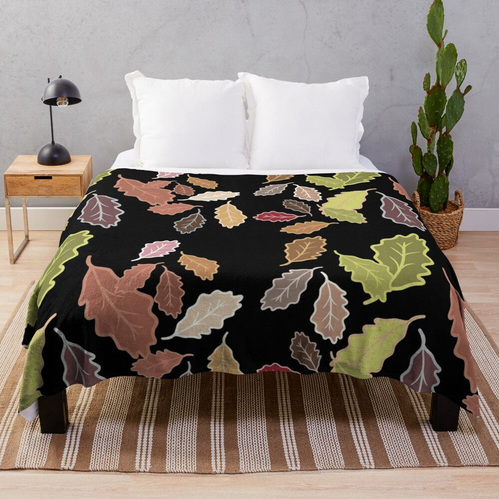 Plush blanket with abstract fall leaves and dull color palette