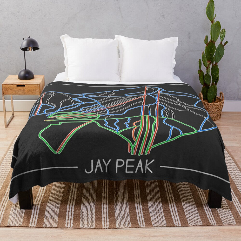 Plush blanket with trail map design for ski and snowboard enthusiasts