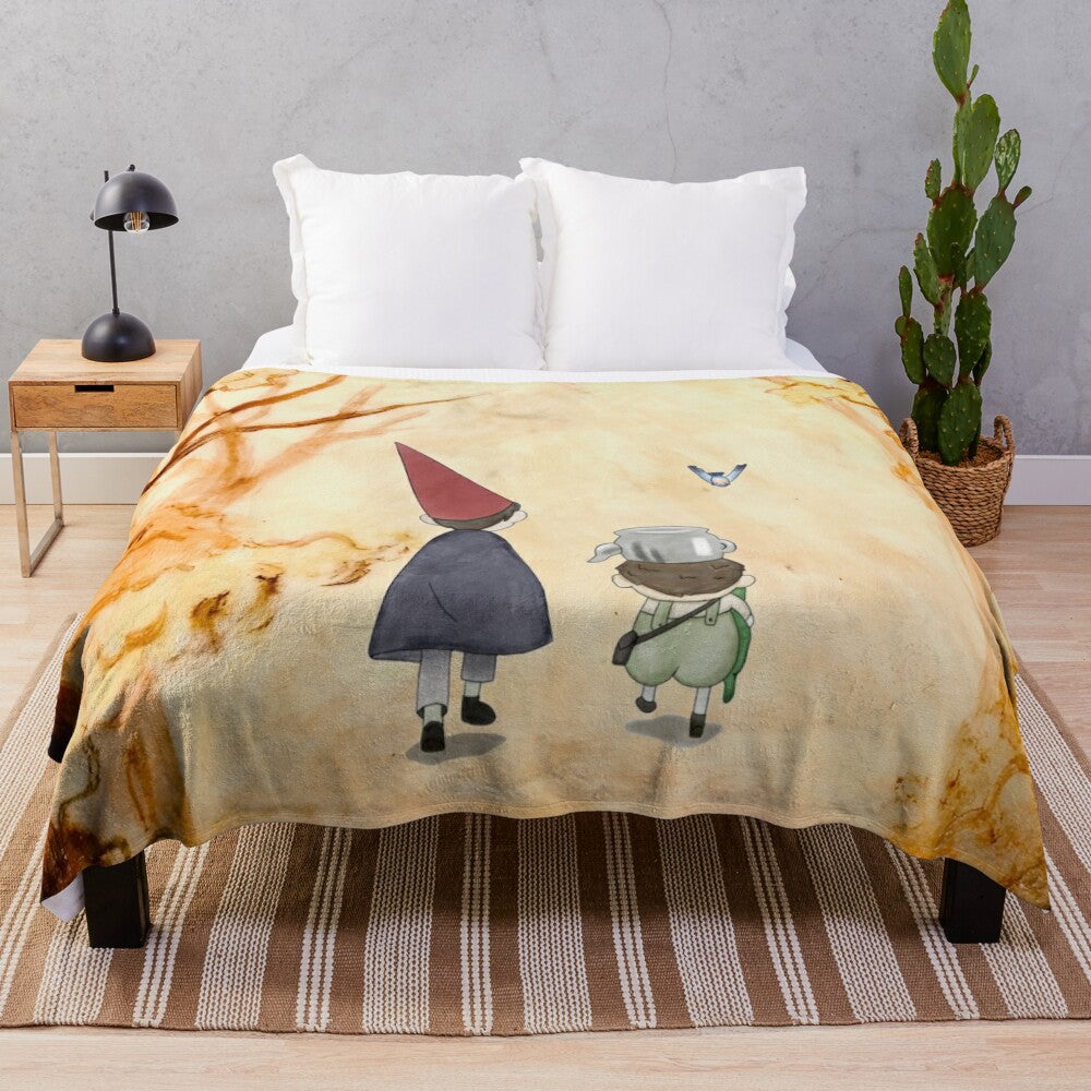 Vibrant watercolor-inspired plush blanket featuring the characters Wirt, Greg, and Beatrice from the animated series Over the Garden Wall