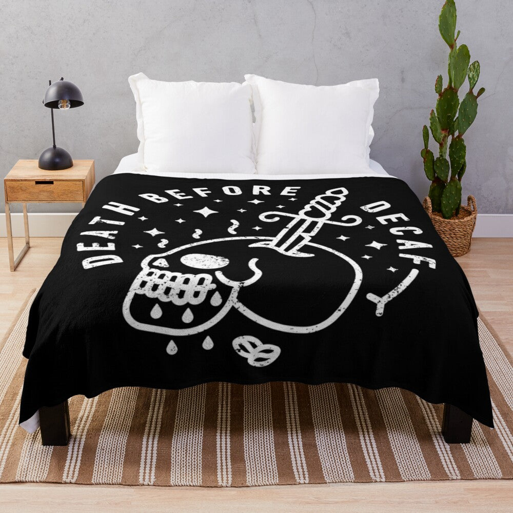 "Death Before Decaf" plush blanket featuring a skull and coffee design