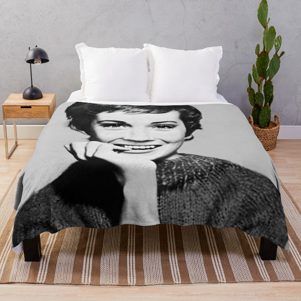 A plush, cozy blanket featuring a vintage-style portrait of actress Julie Andrews