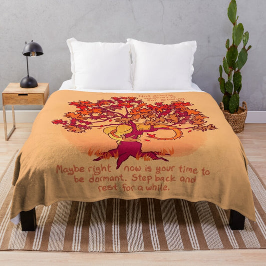 Plush blanket with a whimsical fall dragon design amid autumn leaves