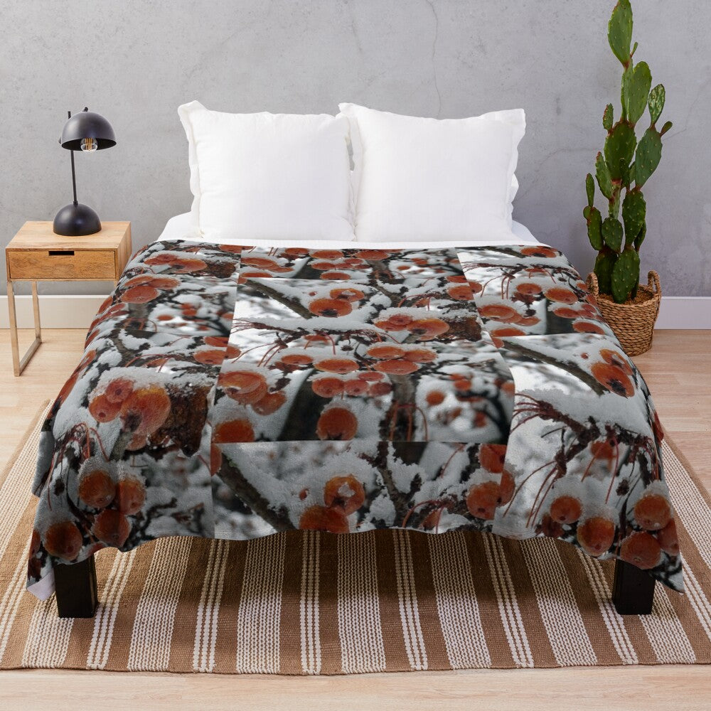 Cozy plush blanket featuring a winter landscape with snowy trees