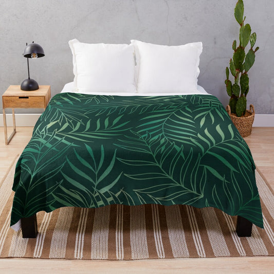 Dark green plush blanket with foliage pattern