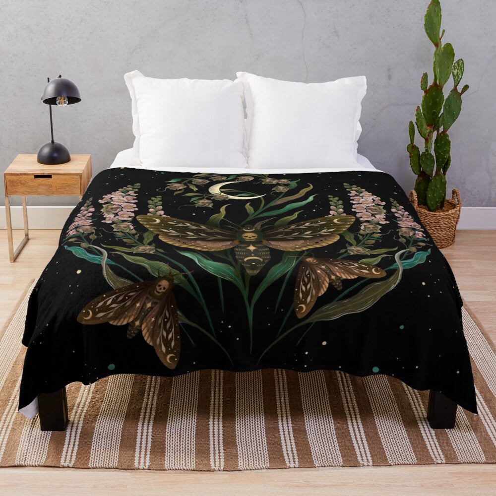 Death's head moth plush blanket with botanical and celestial motifs