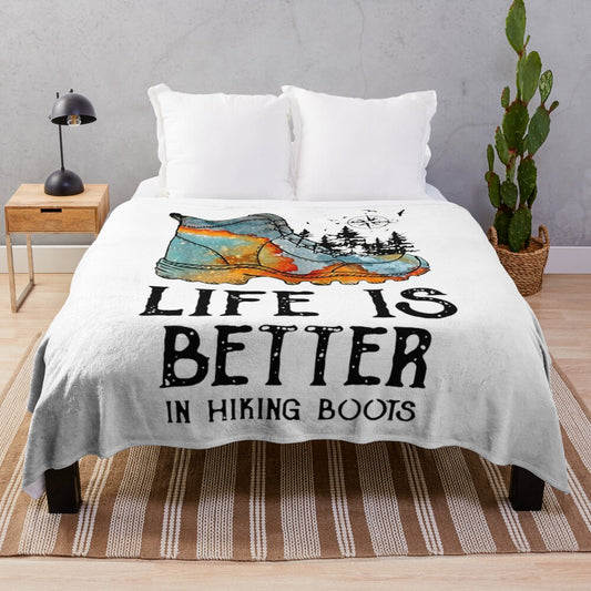 Plush blanket with text "Life is Better in Hiking Boots" and hiking themed design