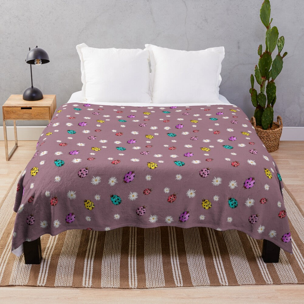 Colorful watercolor floral pattern plush blanket with parade design and ladybug beetle