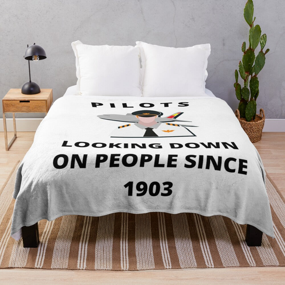 Plush blanket with humorous airplane pilot design - "Pilots Looking Down Since 1903"