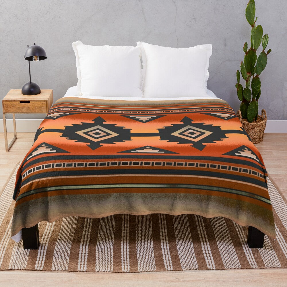 Rust and teal plush blanket with Navajo-inspired geometric pattern