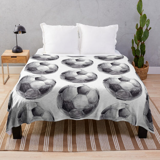 Watercolor plush sports blanket with soccer-themed design