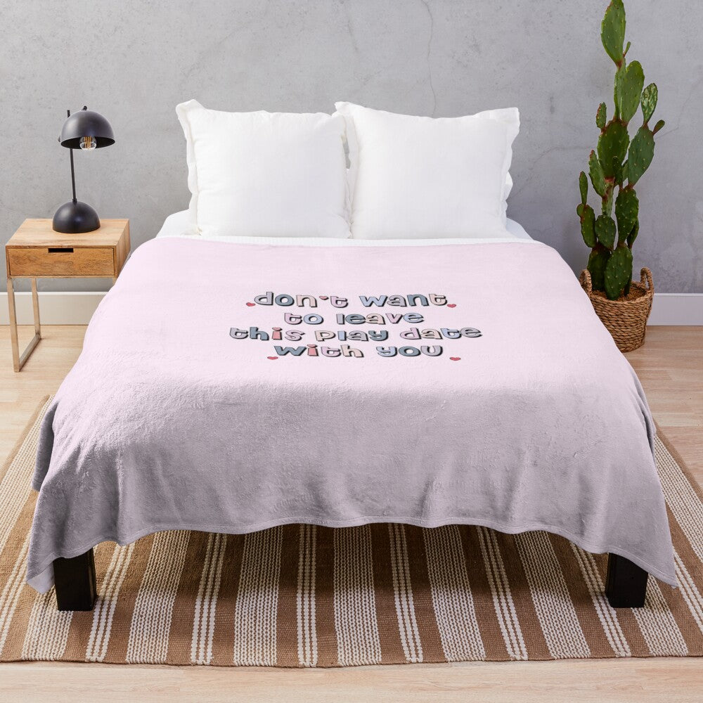 Plush blanket with pastel colors, text, and typography design