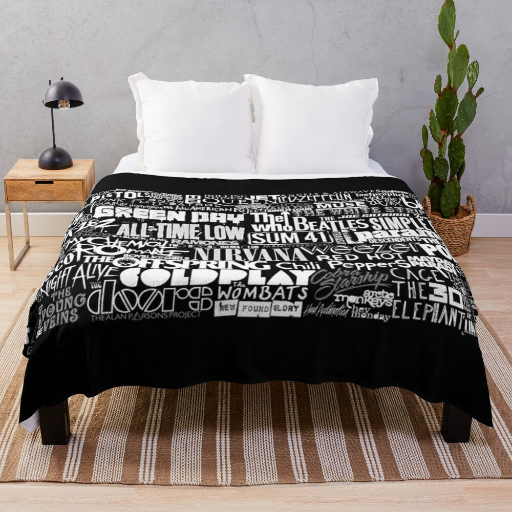 Cozy plush blanket featuring a vibrant collage of popular band imagery and lyrics