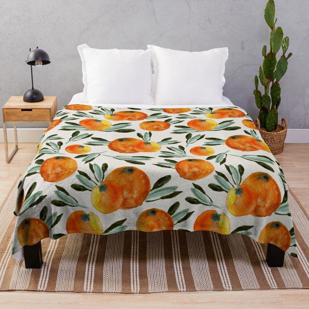 Vibrant orange plush blanket with a watercolor background pattern