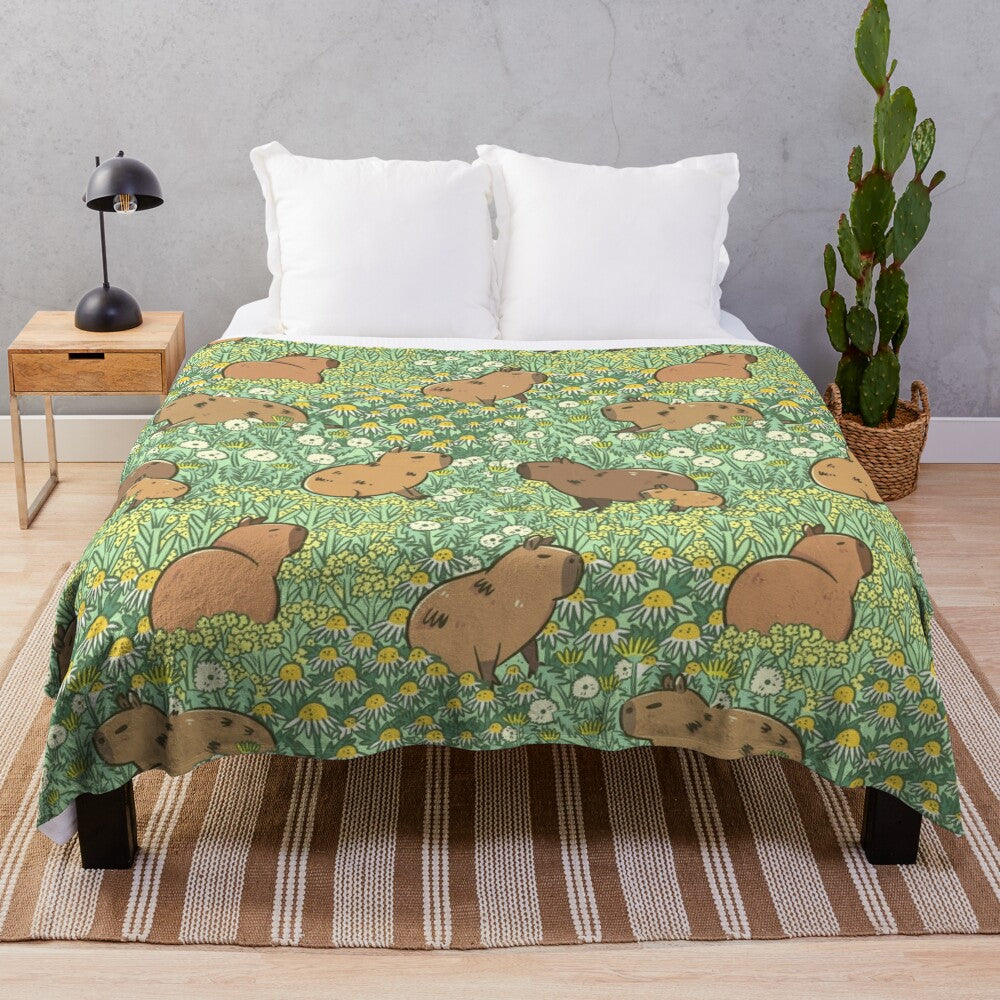 Plush blanket featuring a repeating pattern of capybaras in a lush green and yellow meadow