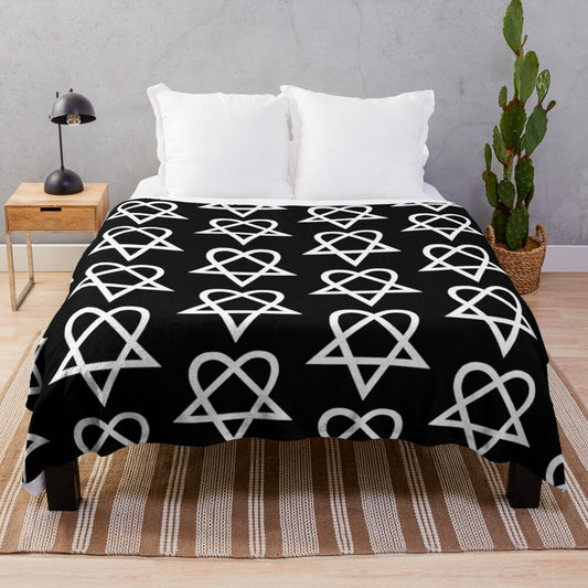 Heartagram plush blanket with a white and black design