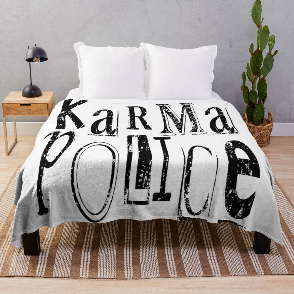 Karma Police themed plush blanket with band graphics and lyrics