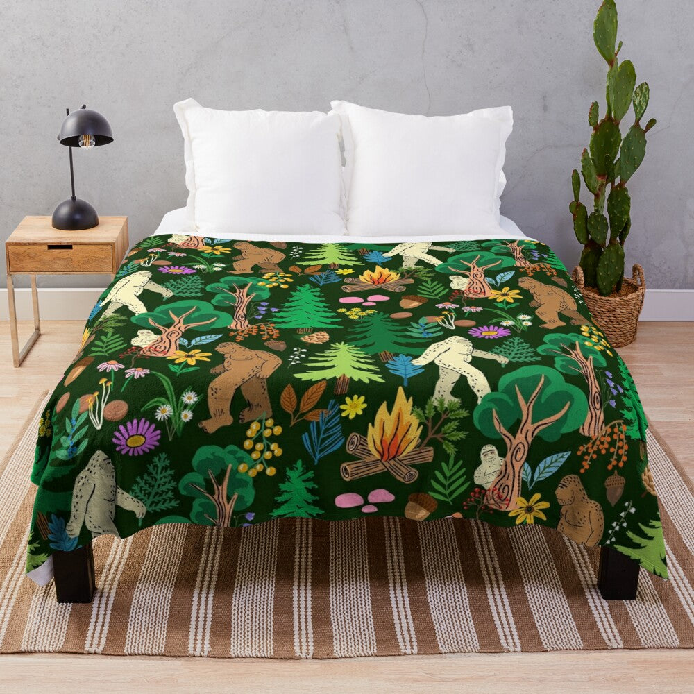 A cozy plush blanket featuring a forest scene with bigfoot, sasquatch, and other nature elements.