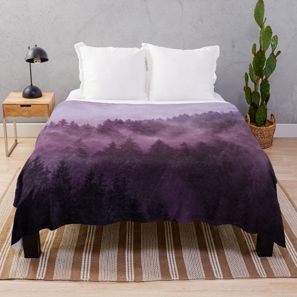 Plush blanket with a dreamy, moody forest landscape design