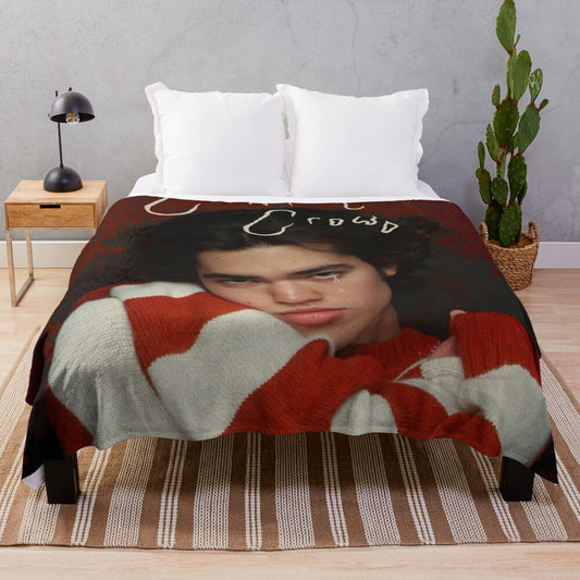 Cozy red plush blanket with retro-inspired music themed pattern