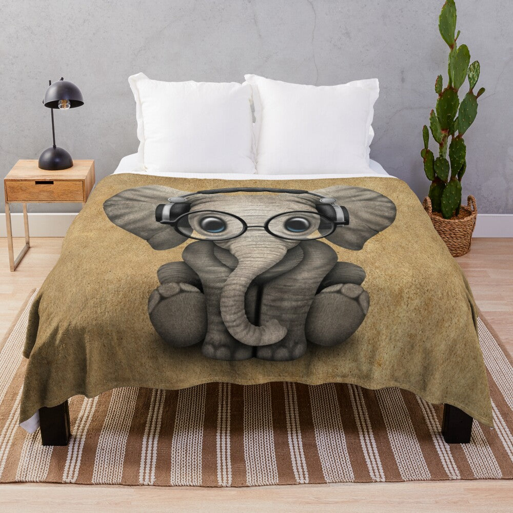 Cute baby elephant wearing headphones and glasses on a soft, cozy plush blanket