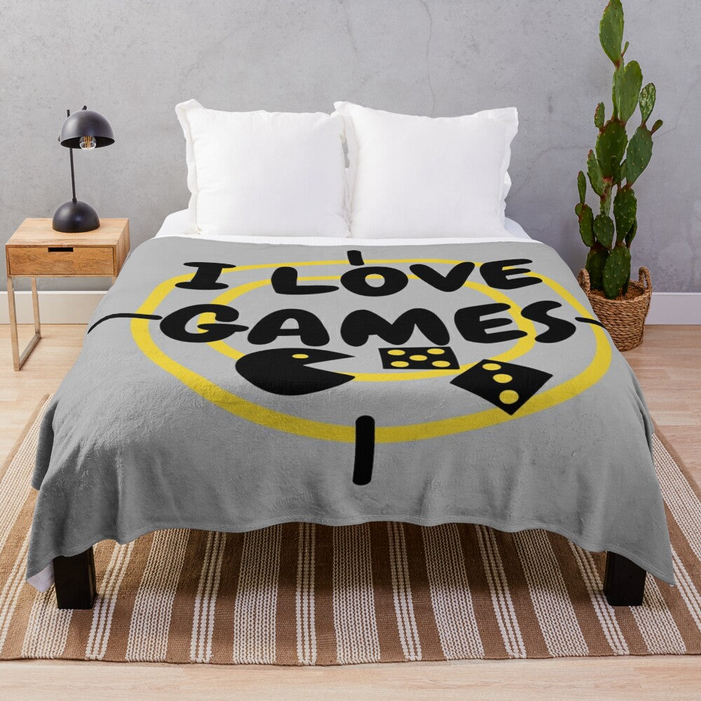 Plush blanket with a games design for gaming enthusiasts