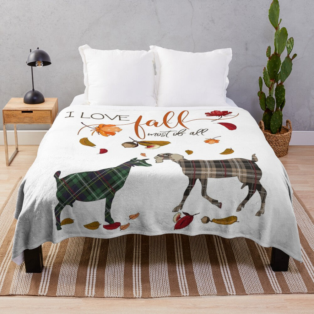 Plush blanket featuring a goat design and autumn leaves and acorns