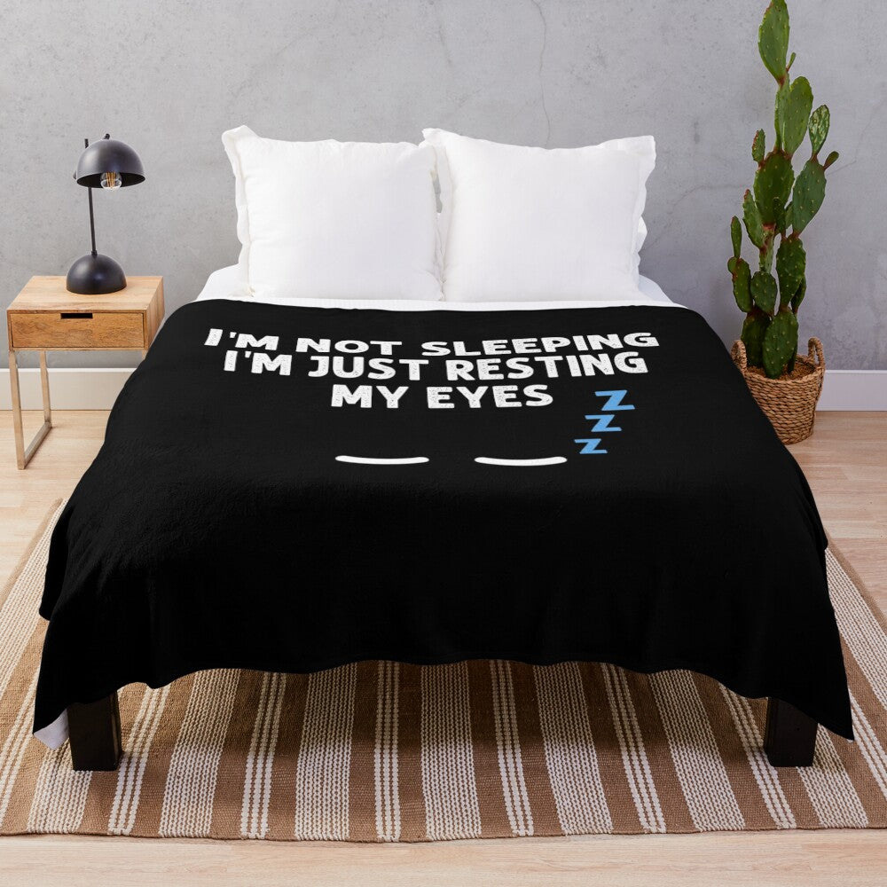 Plush blanket with "I'm not sleeping, I'm just resting my eyes" design