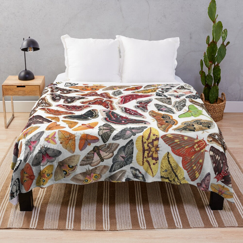 Soft plush blanket featuring a detailed illustration of saturniid moths from North America