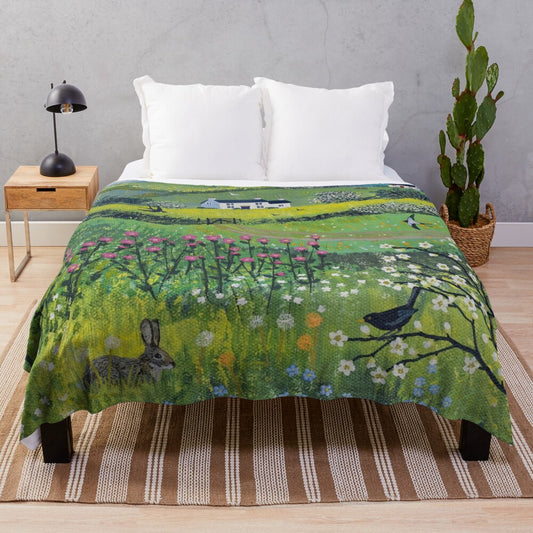 Plush blanket with pastoral countryside and nature-themed design