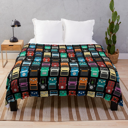 Plush blanket with guitar pedal design