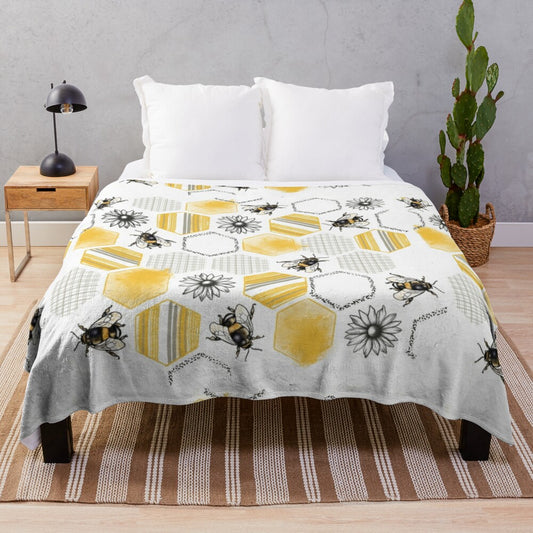 Soft and cozy plush blanket with a vibrant honeycomb and floral pattern in yellow, orange, and gold colors.