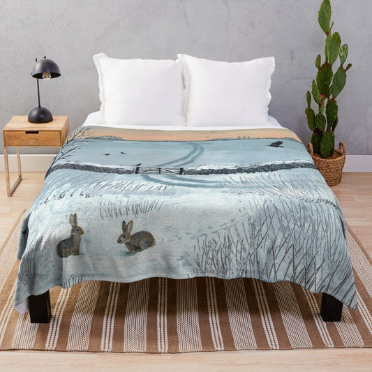 Cozy plush blanket featuring a winter landscape with rabbits in the snow