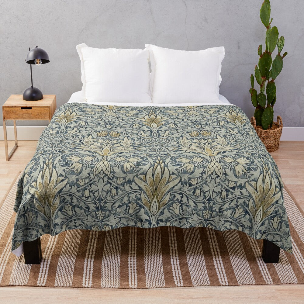 Plush blanket featuring the iconic snakeshead pattern designed by William Morris