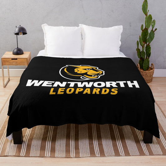 Wentworth Institute of Technology plush blanket featuring the school's logo and colors