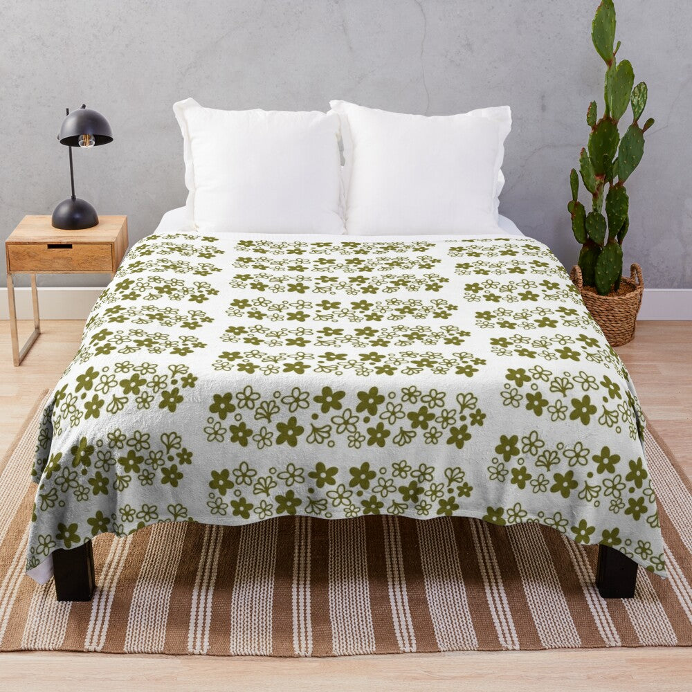 Vintage-inspired plush blanket featuring the iconic Pyrex Spring Blossom design in a cozy avocado green color