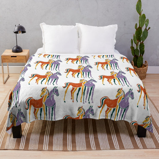 Plush blanket featuring a colorful horse print design