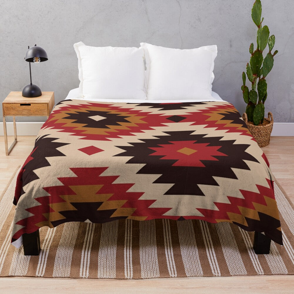 Navajo-inspired plush blanket with red and mustard colors and tribal pattern