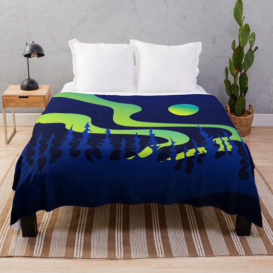 Plush blanket with northern lights and indigenous design