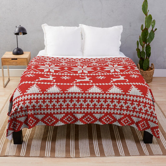 Fair Isle style Christmas plush blanket with geometric patterns, snowflakes, and reindeer