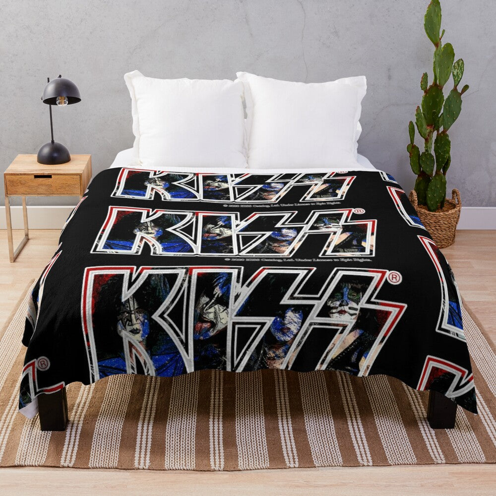 A plush blanket featuring a unique paint-style design of the iconic Kiss band logo