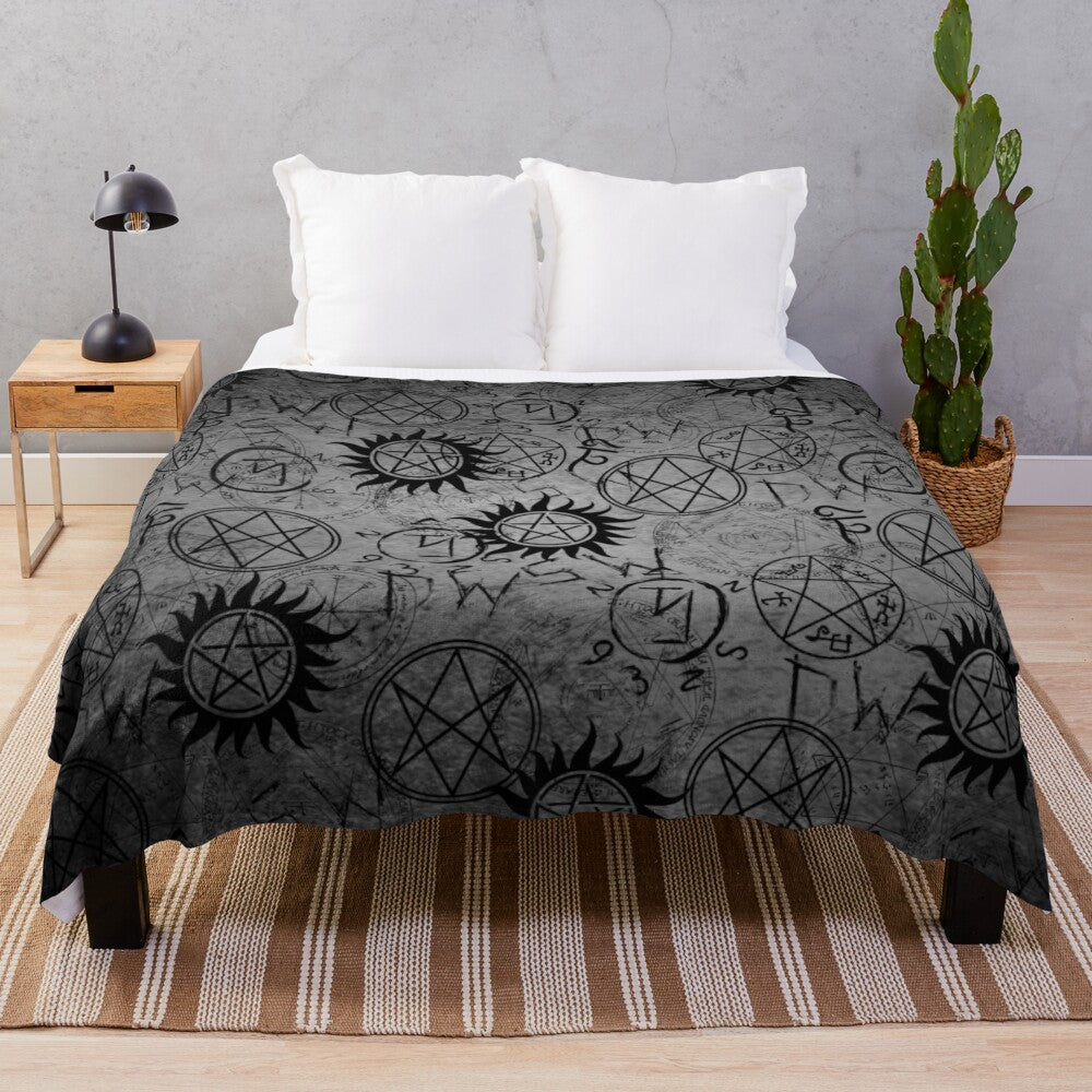 Grey plush blanket with supernatural-inspired design