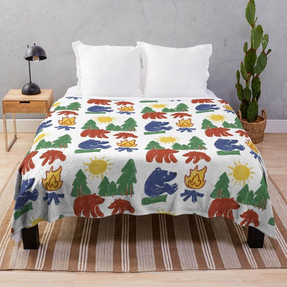 Colorful illustration of camping bears on a plush blanket