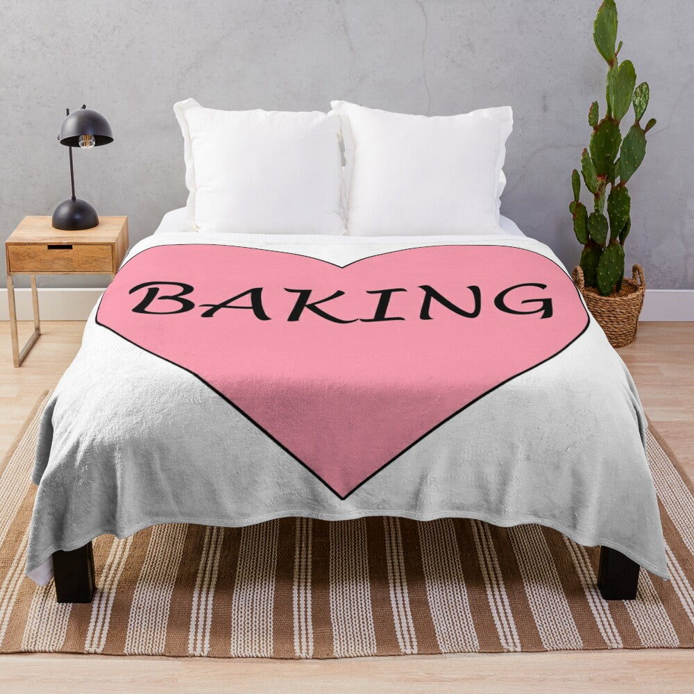 Soft and cuddly plush blanket with a pink heart design, perfect for baking enthusiasts