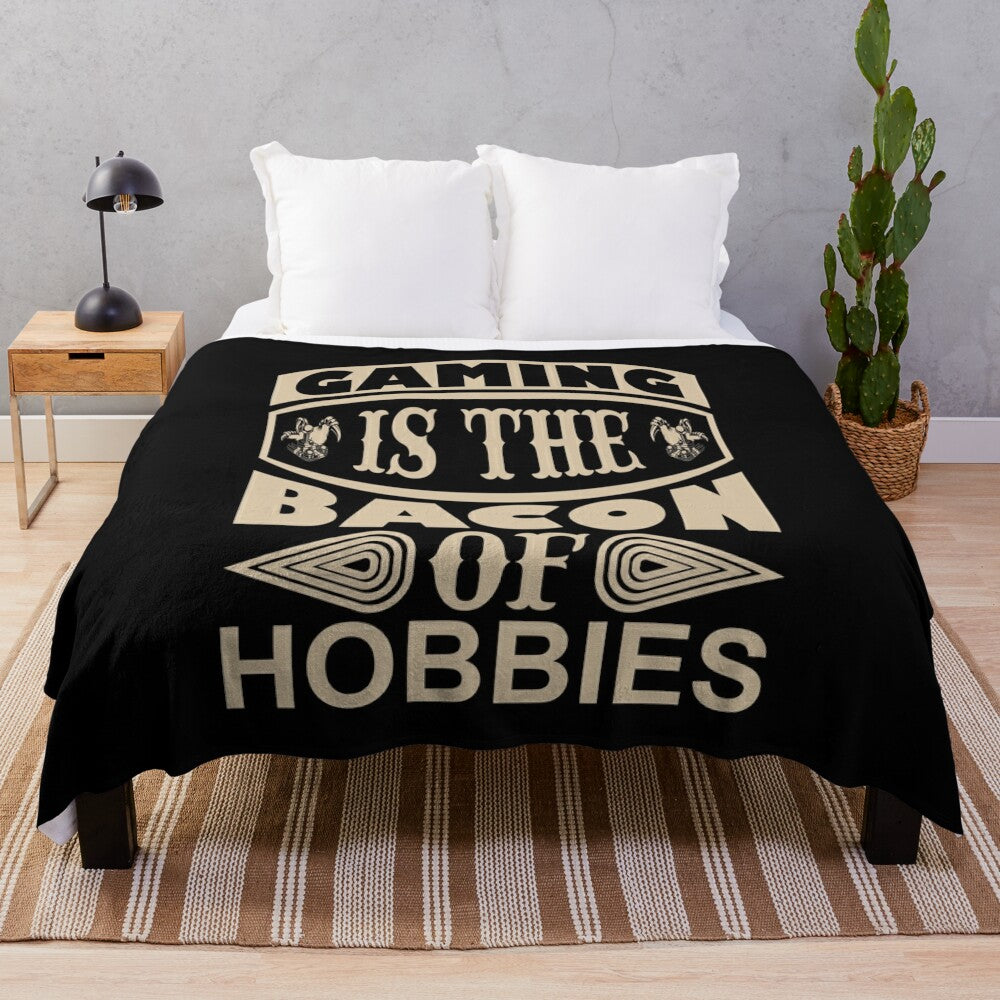 Cozy gaming blanket featuring the text "Gaming Is The Bacon Of Hobbies"